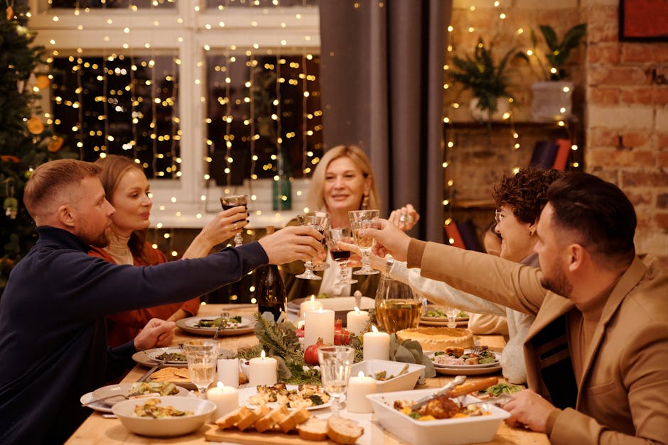 A joyful family gathering celebrating around a festive dining table with Christmas decorations.